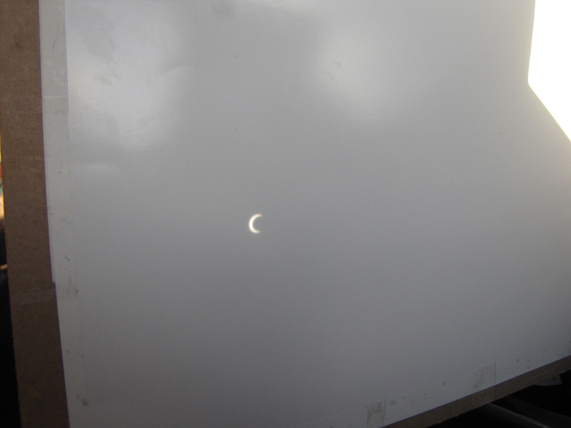 eclipse seen through pinhole and screen