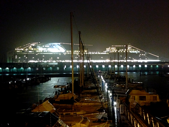 A cruise ship docked at the next pier looks like a space ship